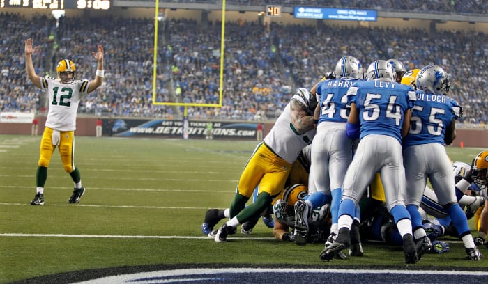 Green Bay Packers No. 12 Aaron Rodgers signals touchdown on a John Kuhn run from the 1 yard line for a touchdown against the Detroit Lions during the NFL Thanksgiving day game between the Green Bay Packers-Detroit Lions at Ford Field, Thursday, November 24, 2011. Photo by Rick Wood/RWOOD@JOURNALSENTINEL.COM